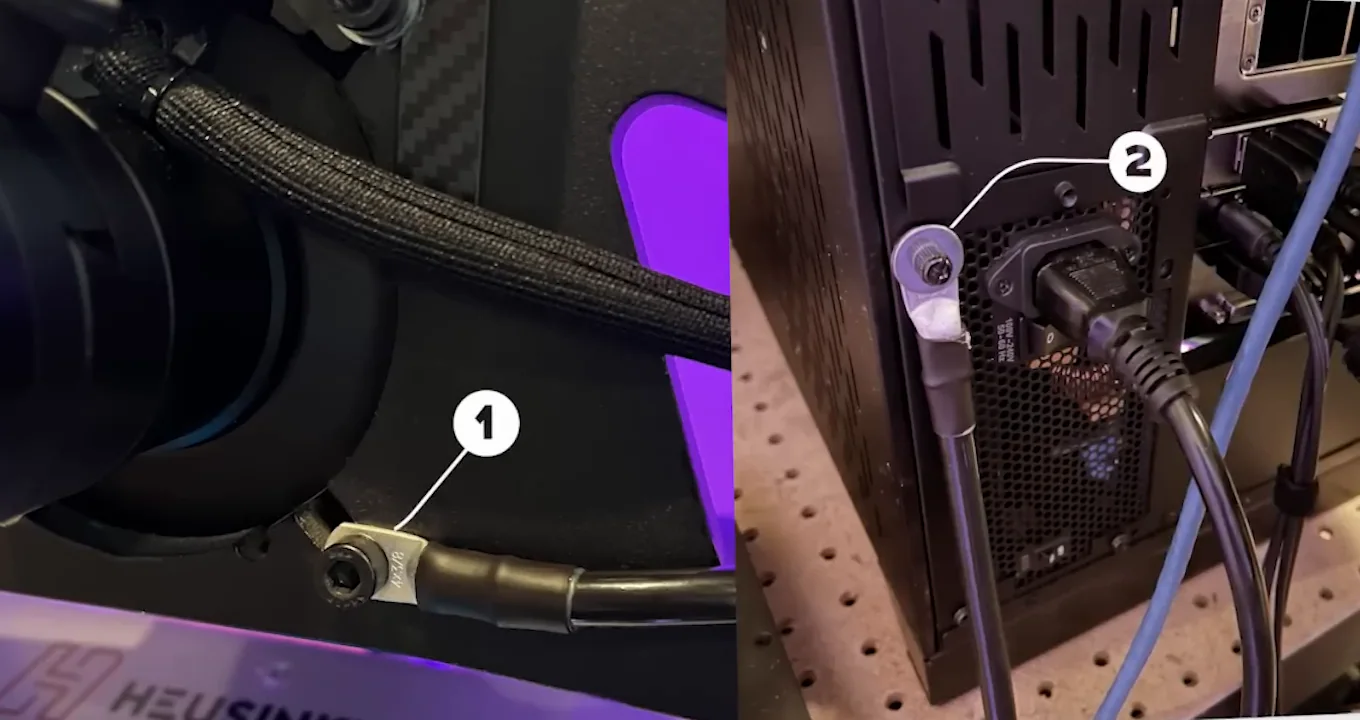 A grounding cable with ring terminals bolted to the wheelbase mount and to the PC case, one of the cheapest sim racing accessories on the list.