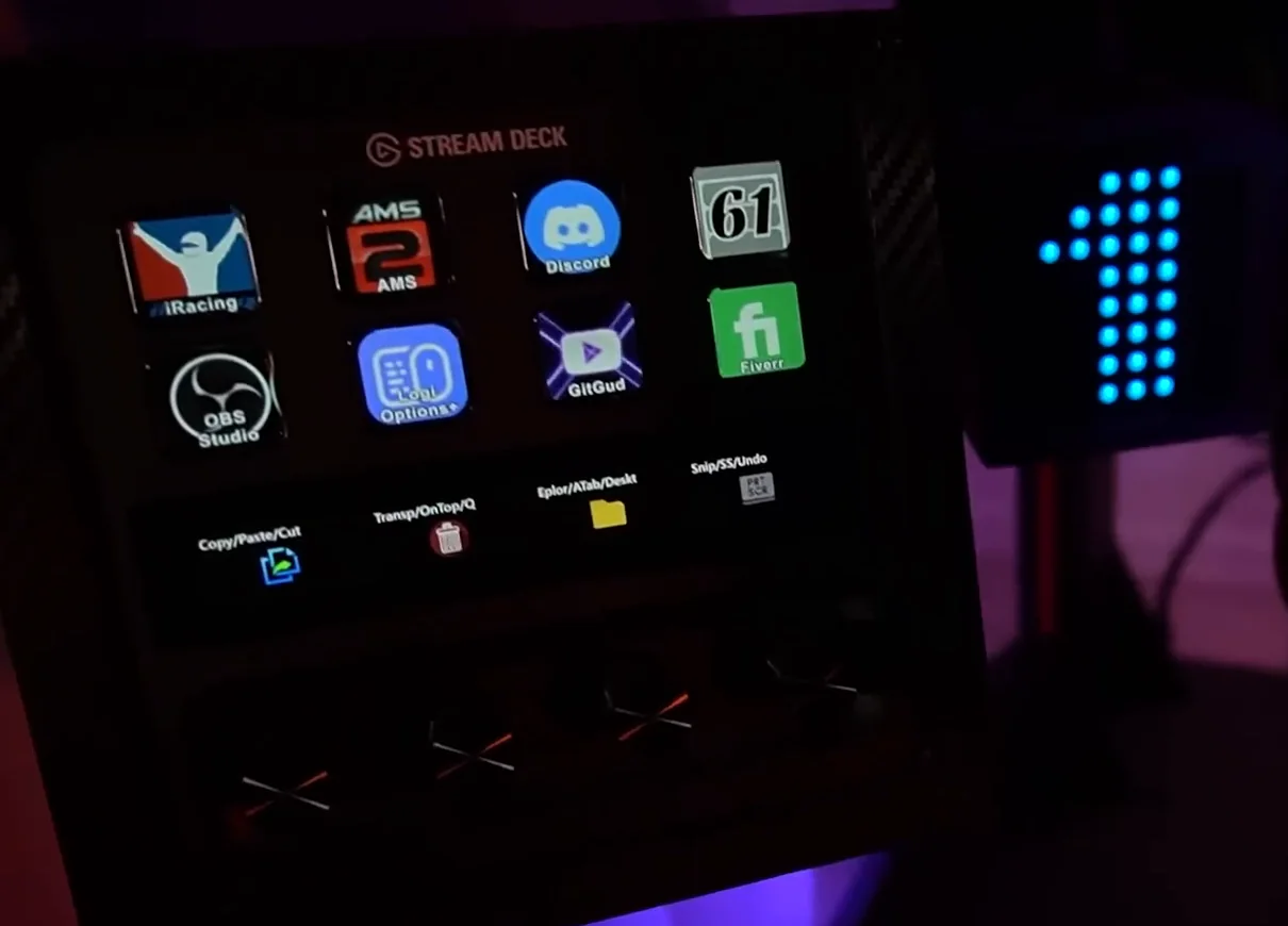 An Elgato Stream Deck mounted on the rig with icons for iRacing, AMS2, Discord, OBS and other launch buttons, a convenience pick among sim racing accessories.