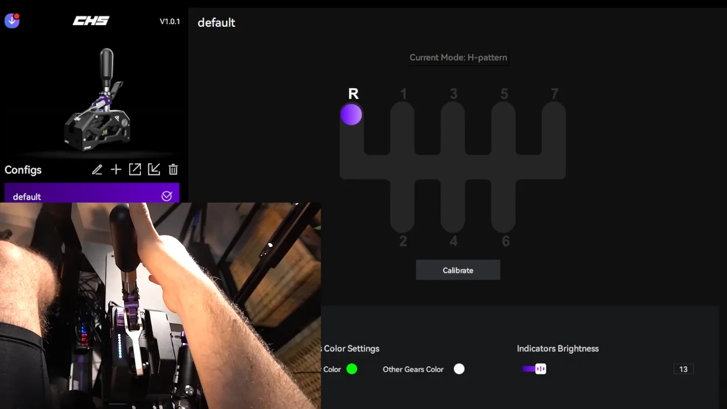 Conspit CHS software showing the H-pattern gate with reverse (R) highlighted, beside a camera inset of a hand on the shifter knob