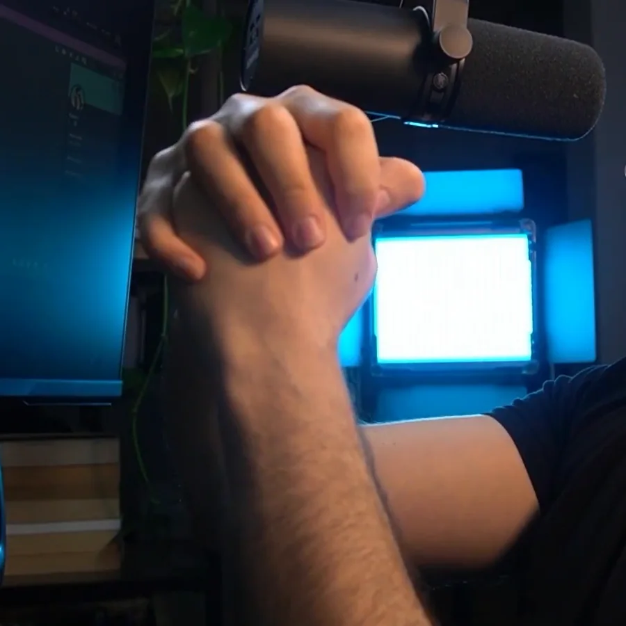 The coach's fist-and-palm demonstration of tyre core and surface temperature used to explain iRacing qualifying out-lap grip.