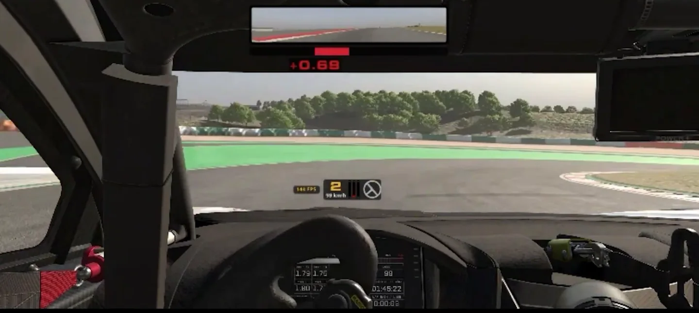 Cockpit view of a slow second-gear corner entry with the brake bar at full on the HUD and the wheel beginning to turn, the overdriven entry among Jason's sim racing braking mistakes.
