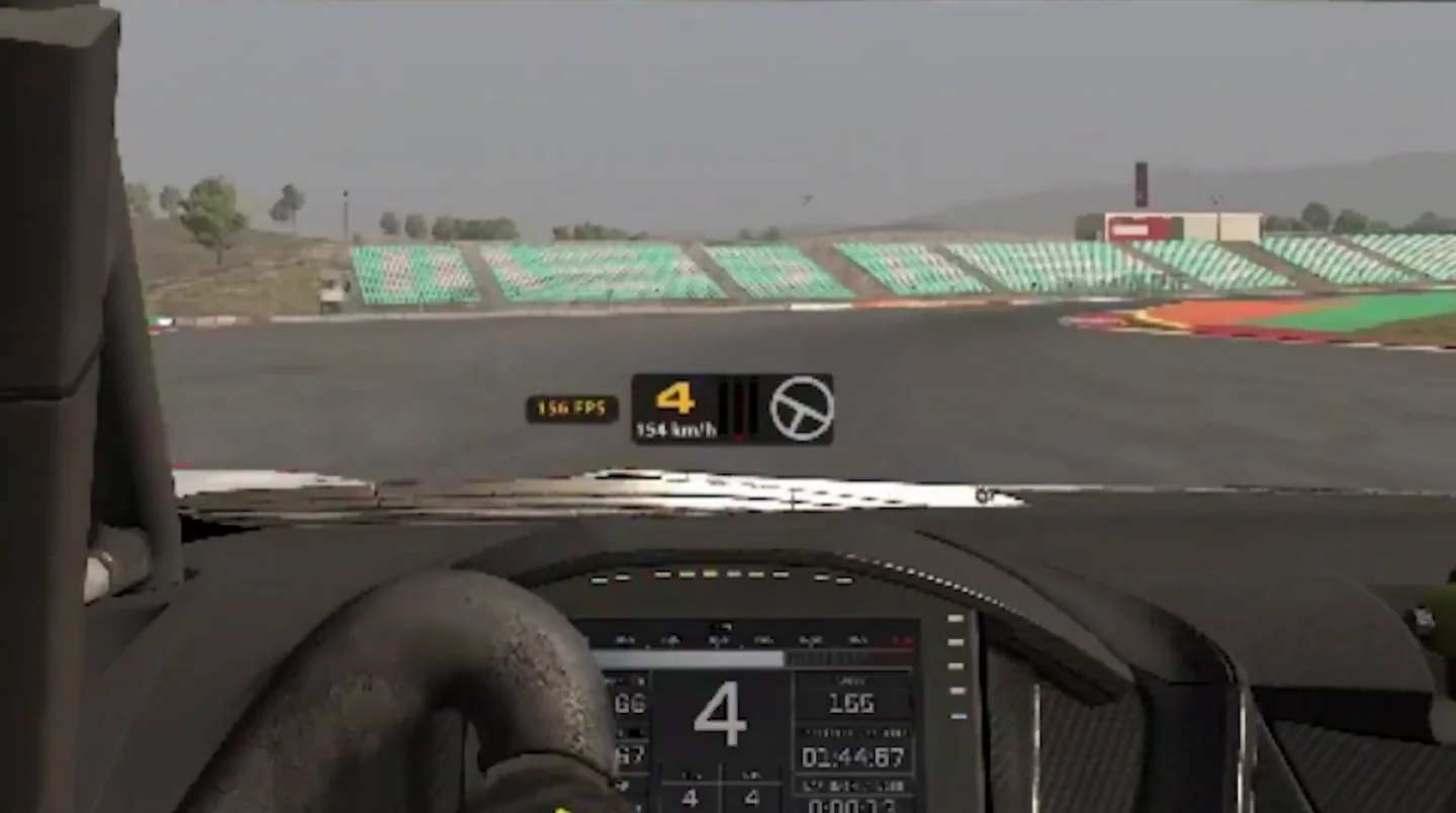 Cockpit view of Jason braking into turn one, the HUD showing fourth gear, 154 km/h and a lit brake bar, the first of the sim racing braking mistakes spotted in his lap.
