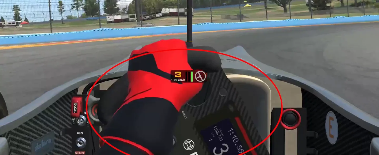 Cockpit view with a red ring drawn around the steering wheel and the driver's hands, the video's note on turning the wheel slowly and as little as possible near the sim racing grip limit.