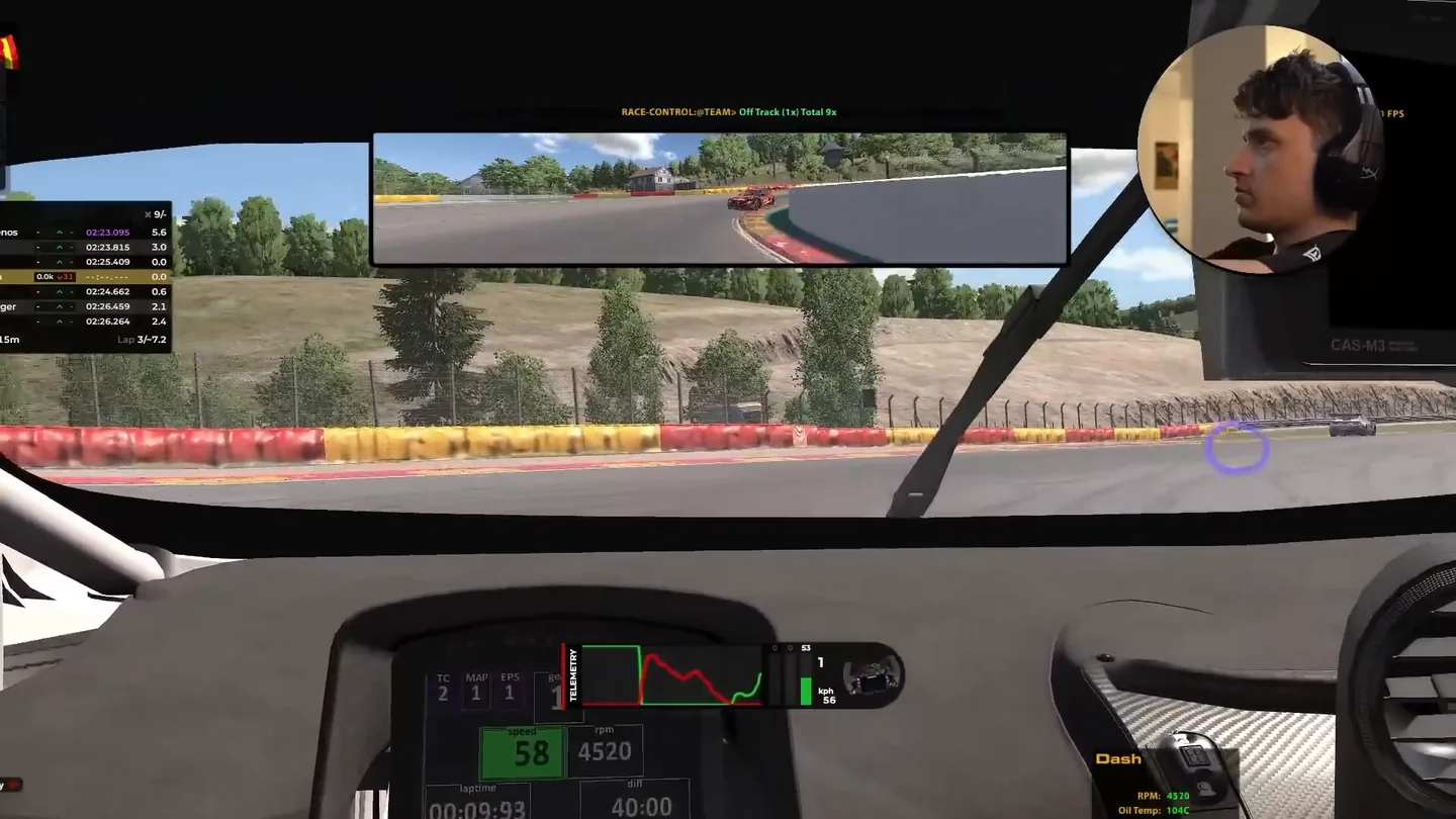 In-car view in iRacing turned toward a corner, with the driver's webcam feed top right and a purple gaze marker on the track, showing sim racing head tracking and eye tracking working together.