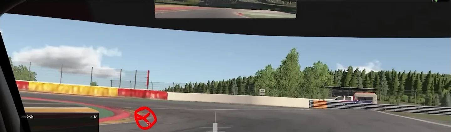 Onboard view approaching a chicane with the coach's red circled cross on the tarmac just past the first kerb, marking where the driver's eyes were fixed, one of the sim racing mistakes in the lap.