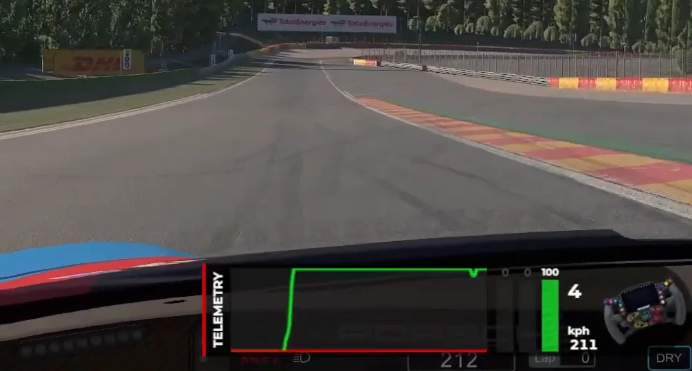 Cockpit view on a corner exit with the telemetry overlay's green throttle trace rising once to full and holding there, the single committed application that good trail braking is built to produce.